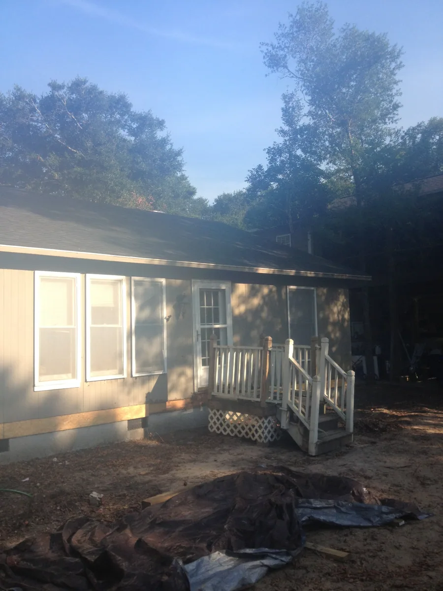 Exterior room enclosure rebuilt with wall and window openings visible