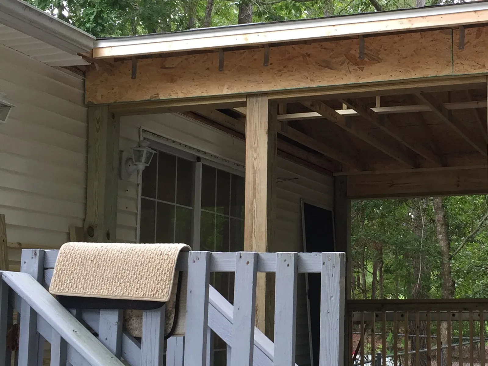 Porch enclosure with structural framing exposed