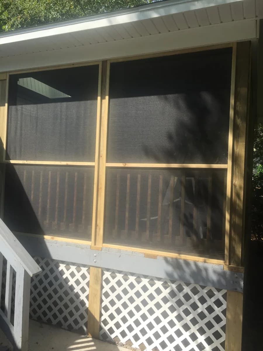 Exterior view of a porch with screened wall panels